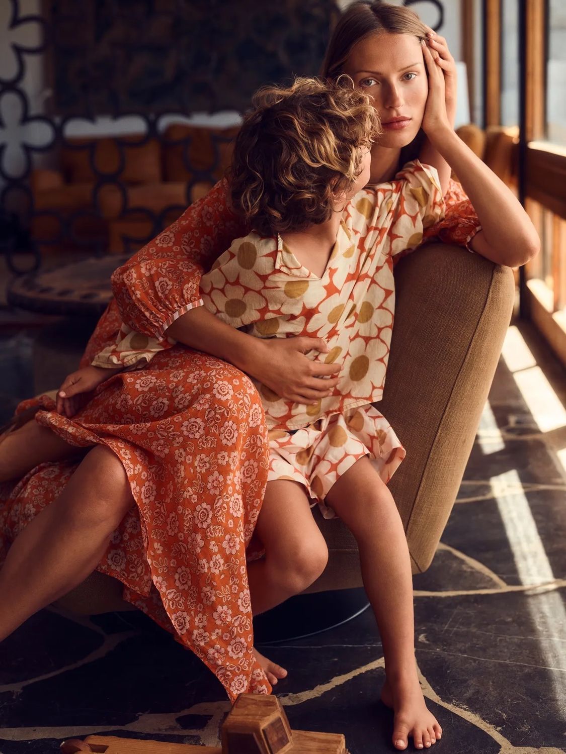 Mother and child in matching floral dresses